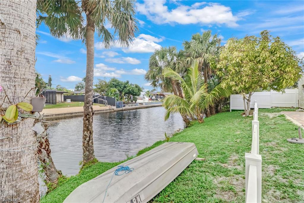 2329 41st Terrace Southwest Naples, FL 34116 - Photo 28 of 33 a view of a garden with lawn chairs