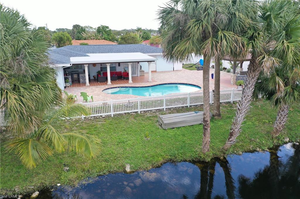 2329 41st Terrace Southwest Naples, FL 34116 - Photo 32 of 33 a house view with a garden space