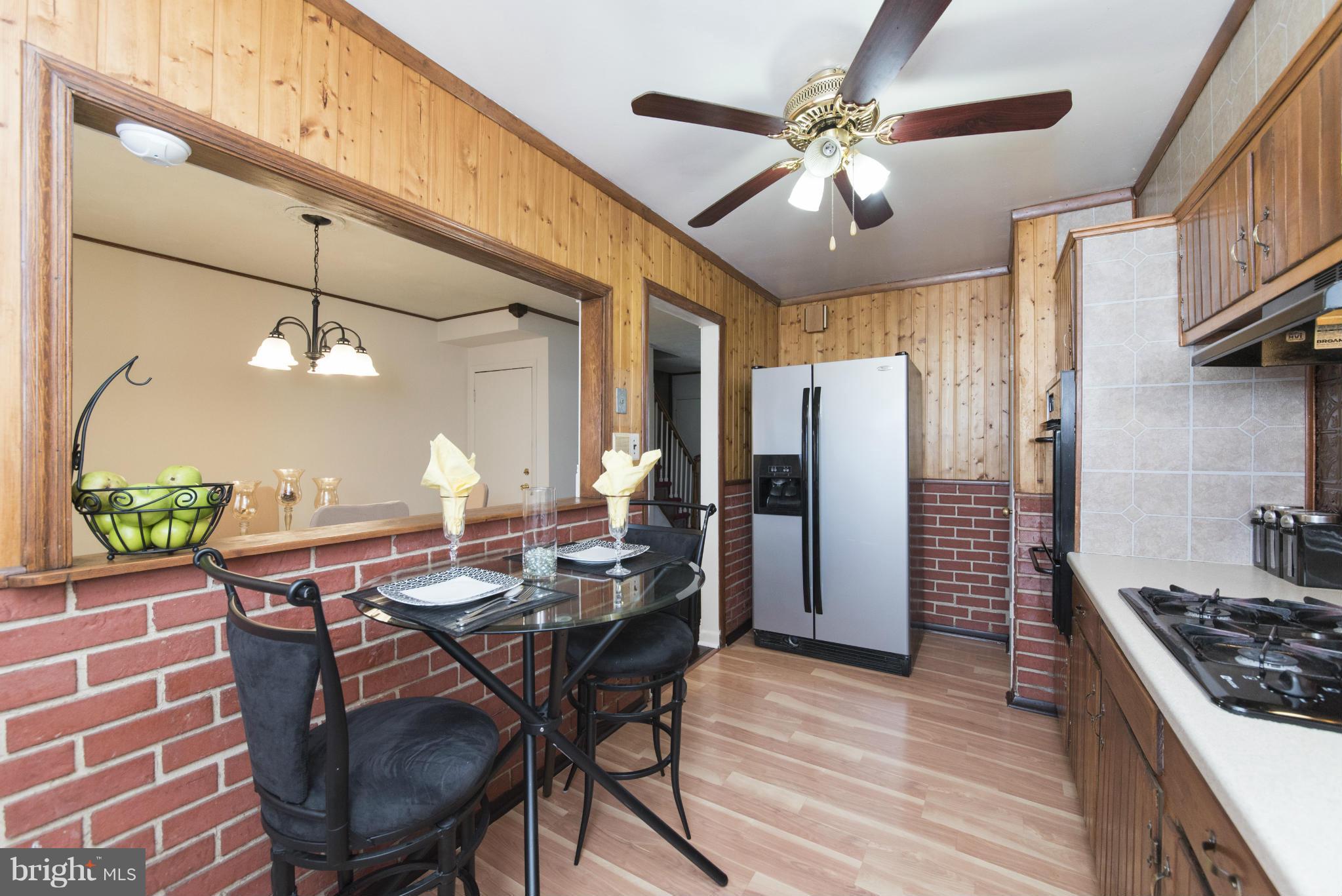 609 South Wickham Road Baltimore, MD 21229 - Photo 14 of 30 a view of a dining room with furniture window and wooden floor