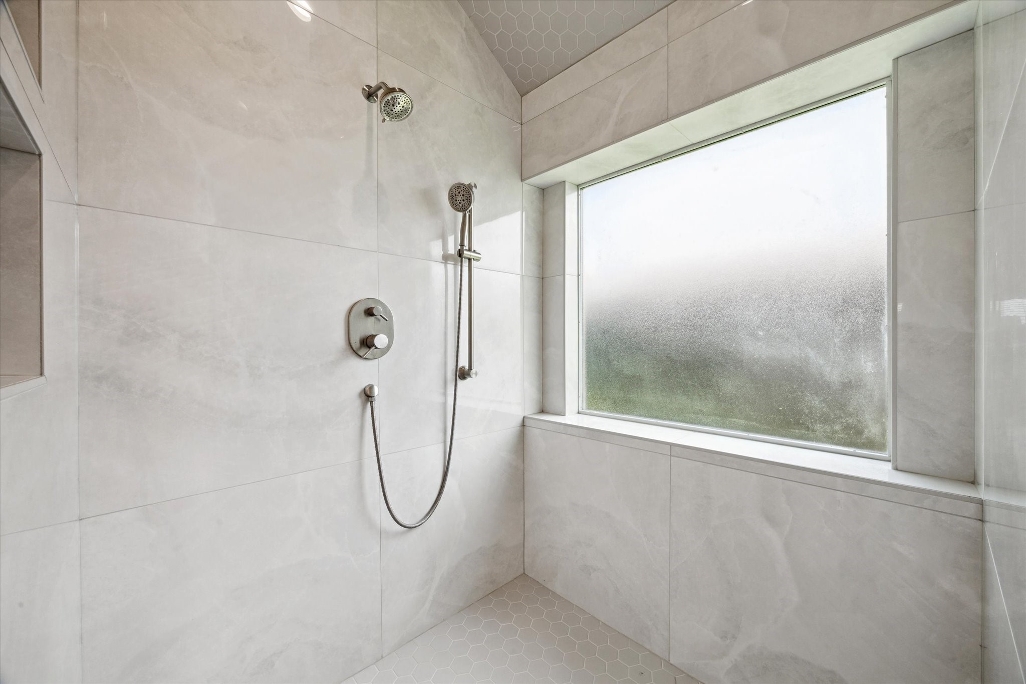416 Twin Timbers Lane Kemah, TX 77565 - Photo 15 of 29 a bathroom with a glass shower door