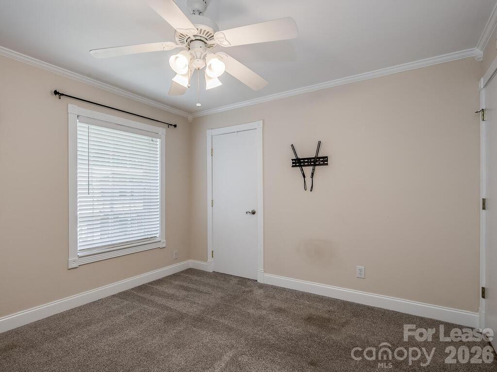 2600 Park Road, Unit D Charlotte, NC 28209 - Photo 14 of 22 wooden floor in an empty room with a window
