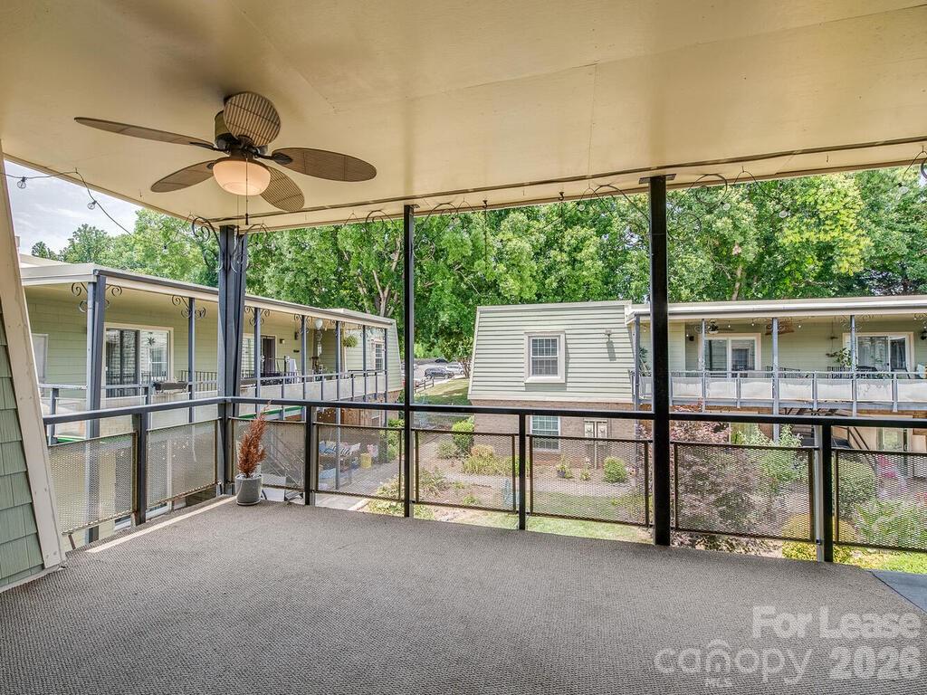 2600 Park Road, Unit D Charlotte, NC 28209 - Photo 20 of 22 a view of a big room with a floor to ceiling window and an outdoor view