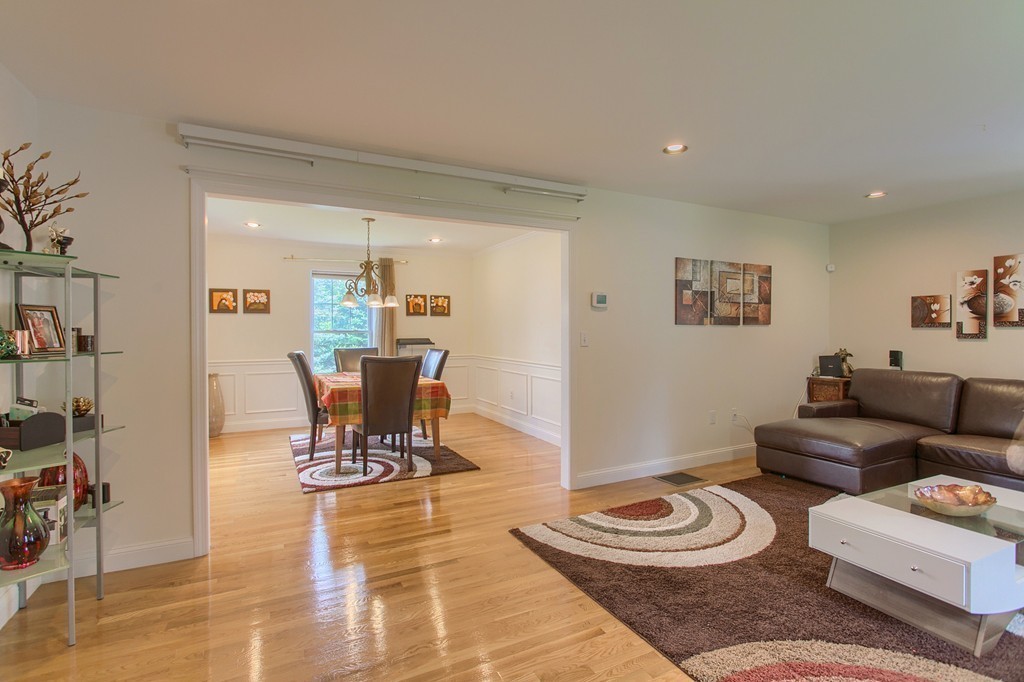 3 Mission Road, Unit 3 Chelmsford, MA 01863 - Photo 7 of 26 a living room with furniture and a wooden floor