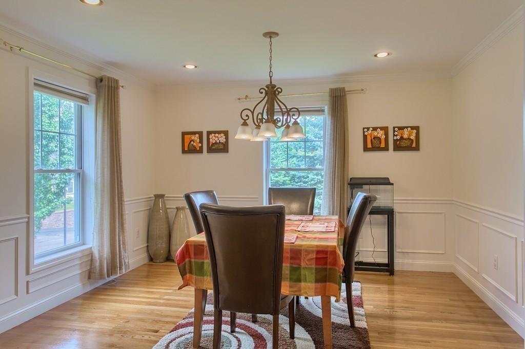 3 Mission Road, Unit 3 Chelmsford, MA 01863 - Photo 8 of 26 a view of a dining room with furniture window and wooden floor