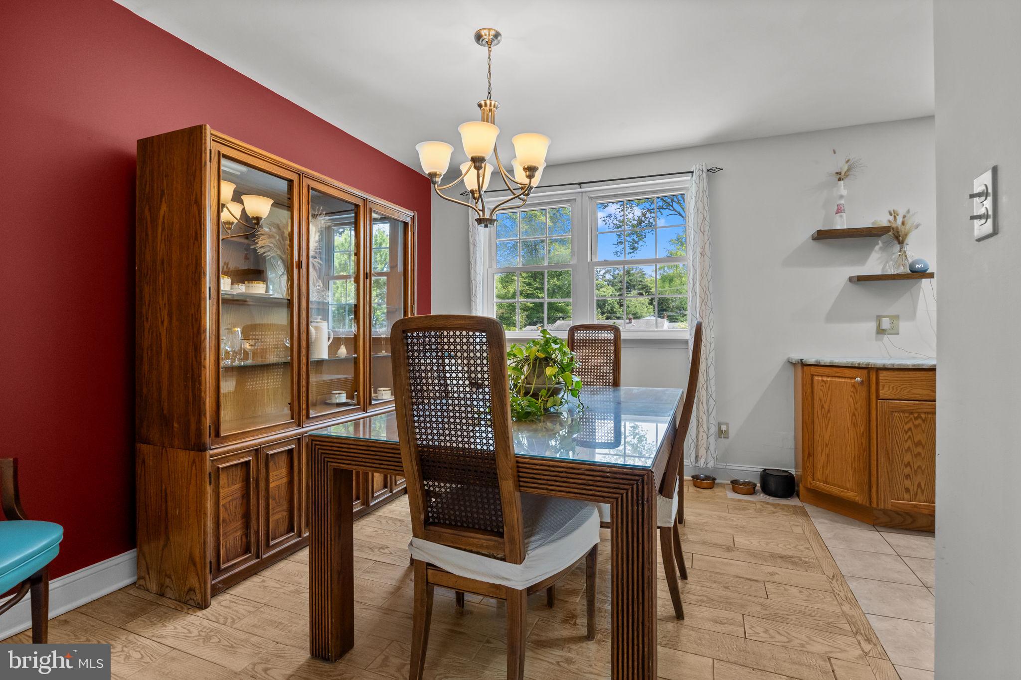 320 Pheasant Run Drive Doylestown, PA 18901 - Photo 12 of 47 a dining room with furniture a chandelier and window