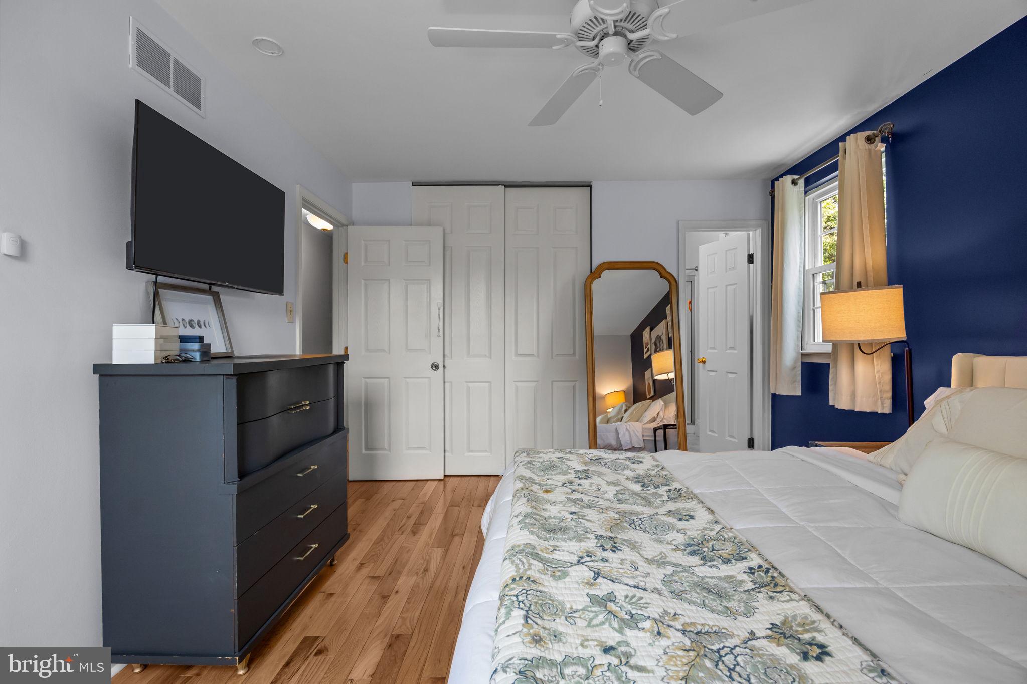 320 Pheasant Run Drive Doylestown, PA 18901 - Photo 18 of 47 a bedroom with a bed and a flat tv screen on dresser