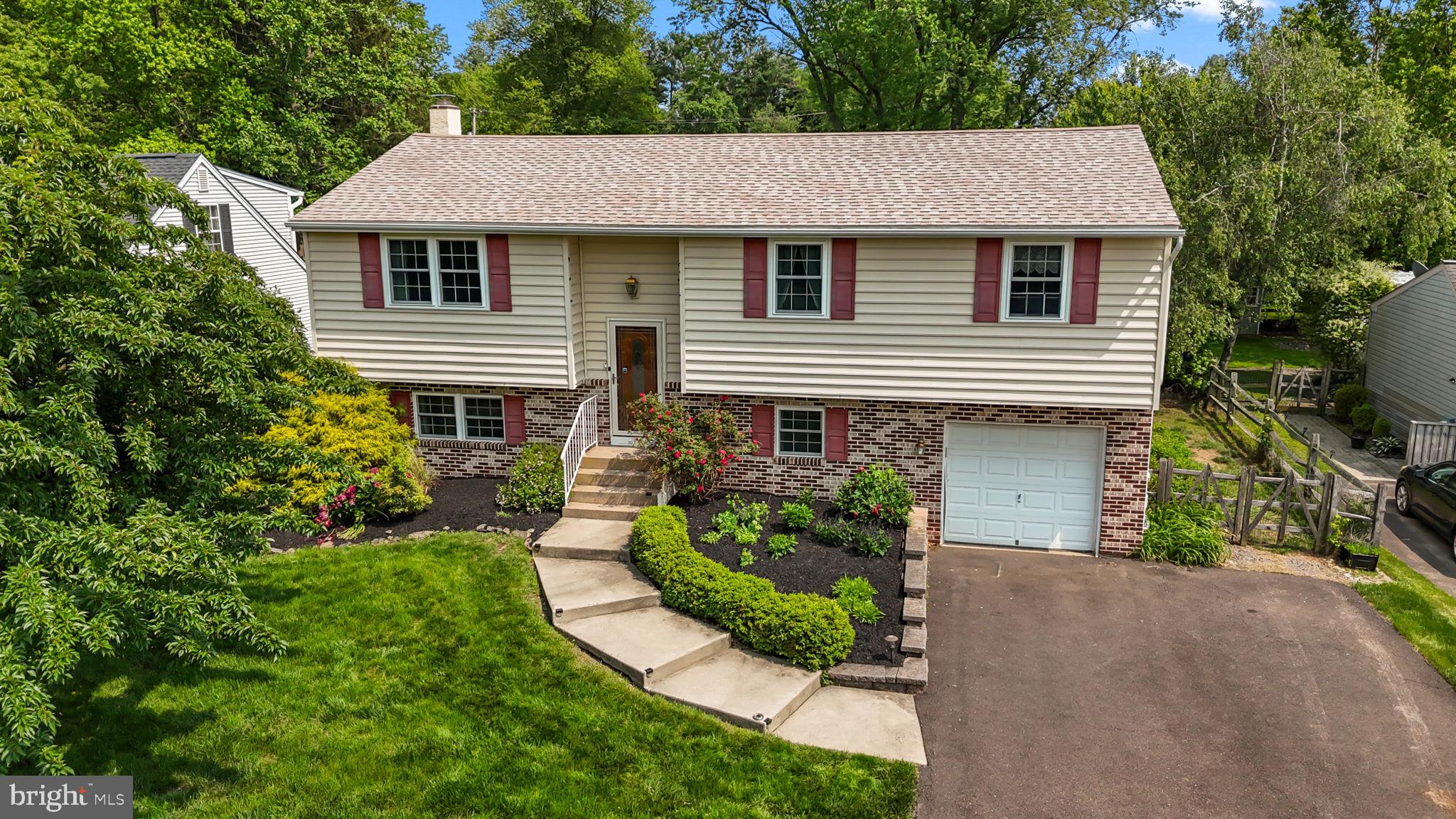 320 Pheasant Run Drive Doylestown, PA 18901 - Photo 2 of 47 a front view of a house with a yard