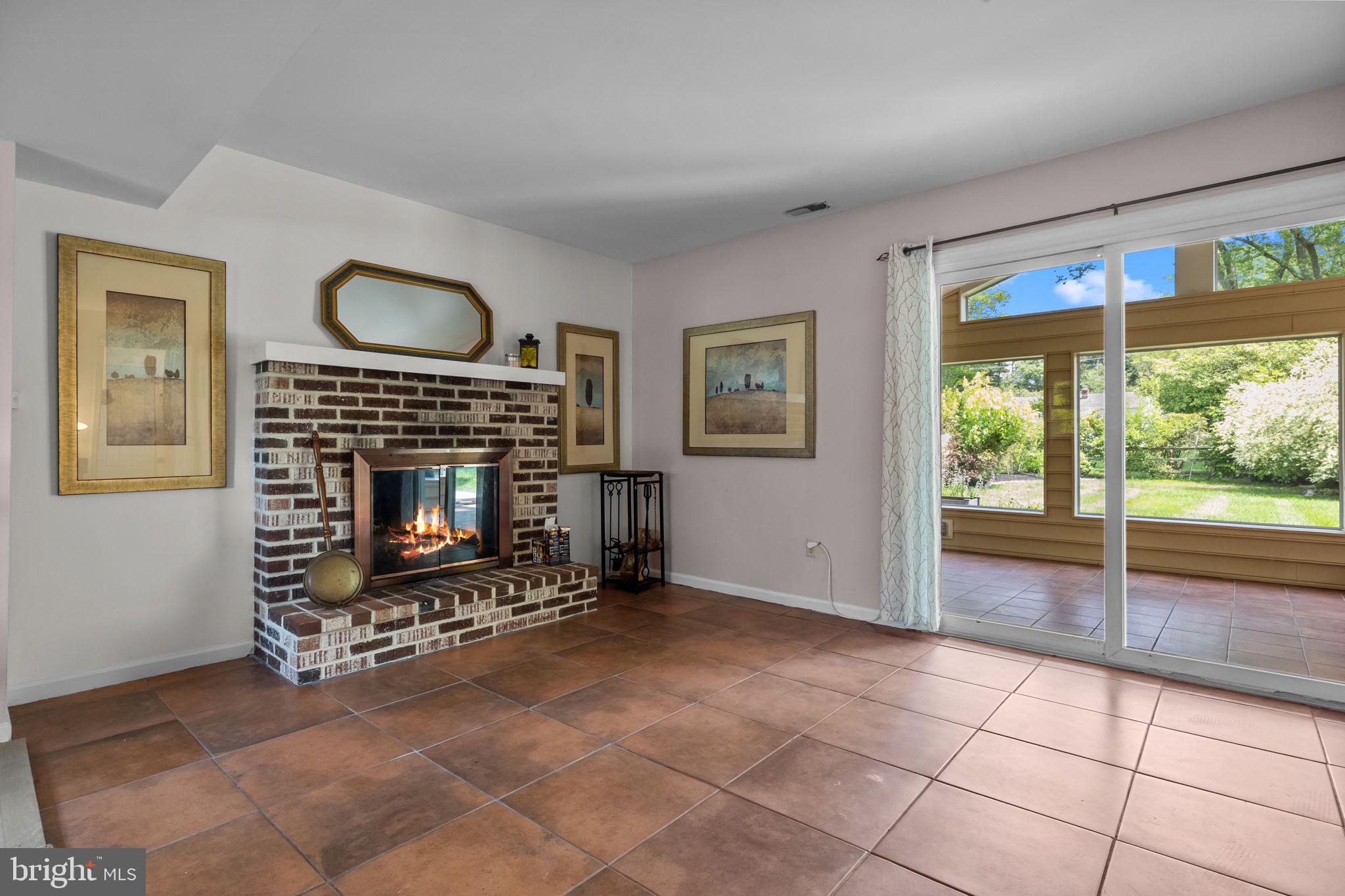 320 Pheasant Run Drive Doylestown, PA 18901 - Photo 22 of 47 a living room with furniture a window and a fireplace
