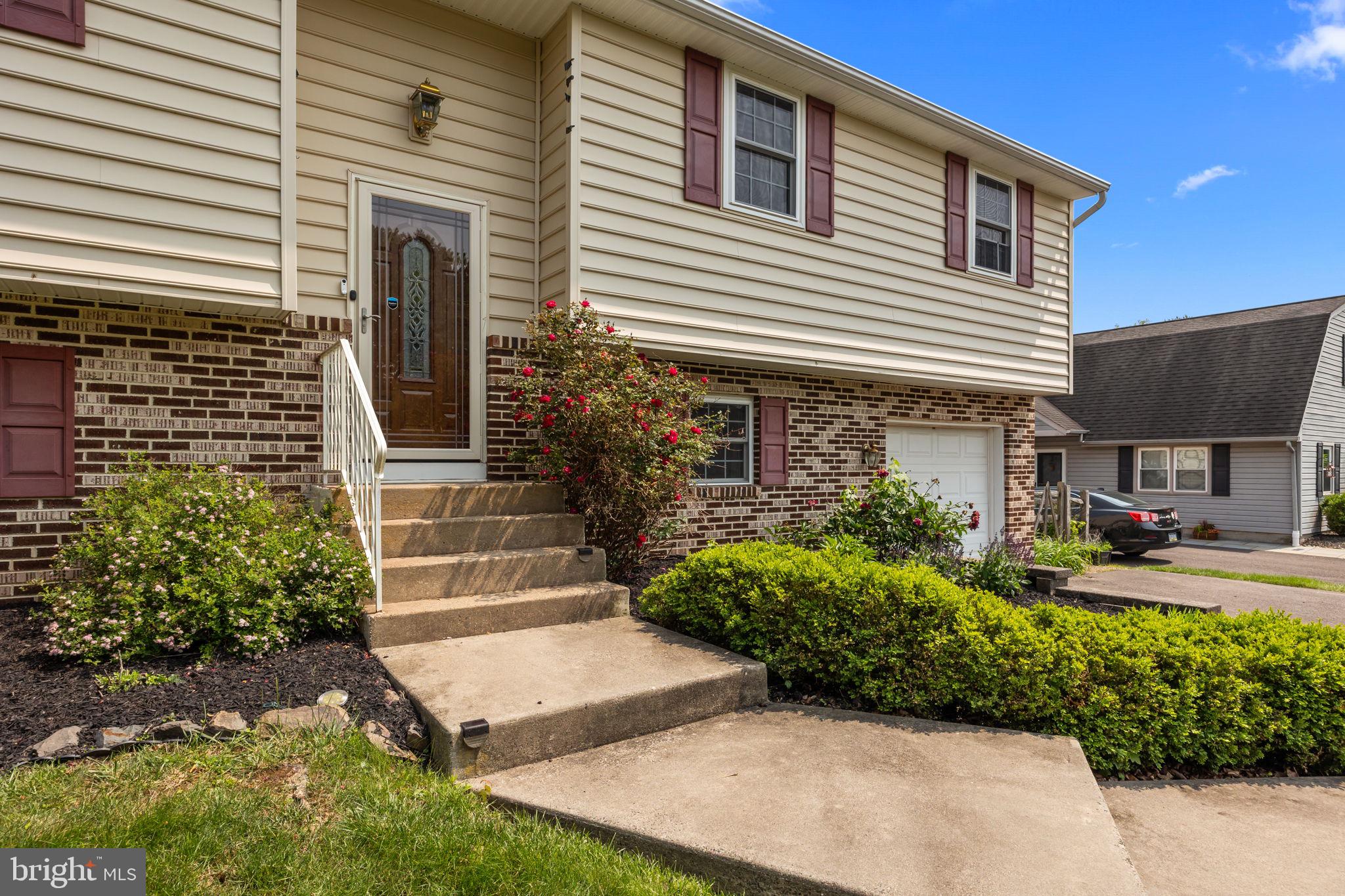320 Pheasant Run Drive Doylestown, PA 18901 - Photo 3 of 47 a front view of a house with garden