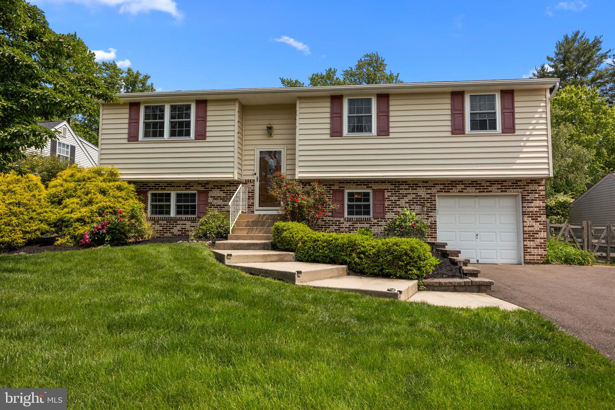 320 Pheasant Run Drive Doylestown, PA 18901 - Photo 43 of 47 a front view of a house with a yard and garage
