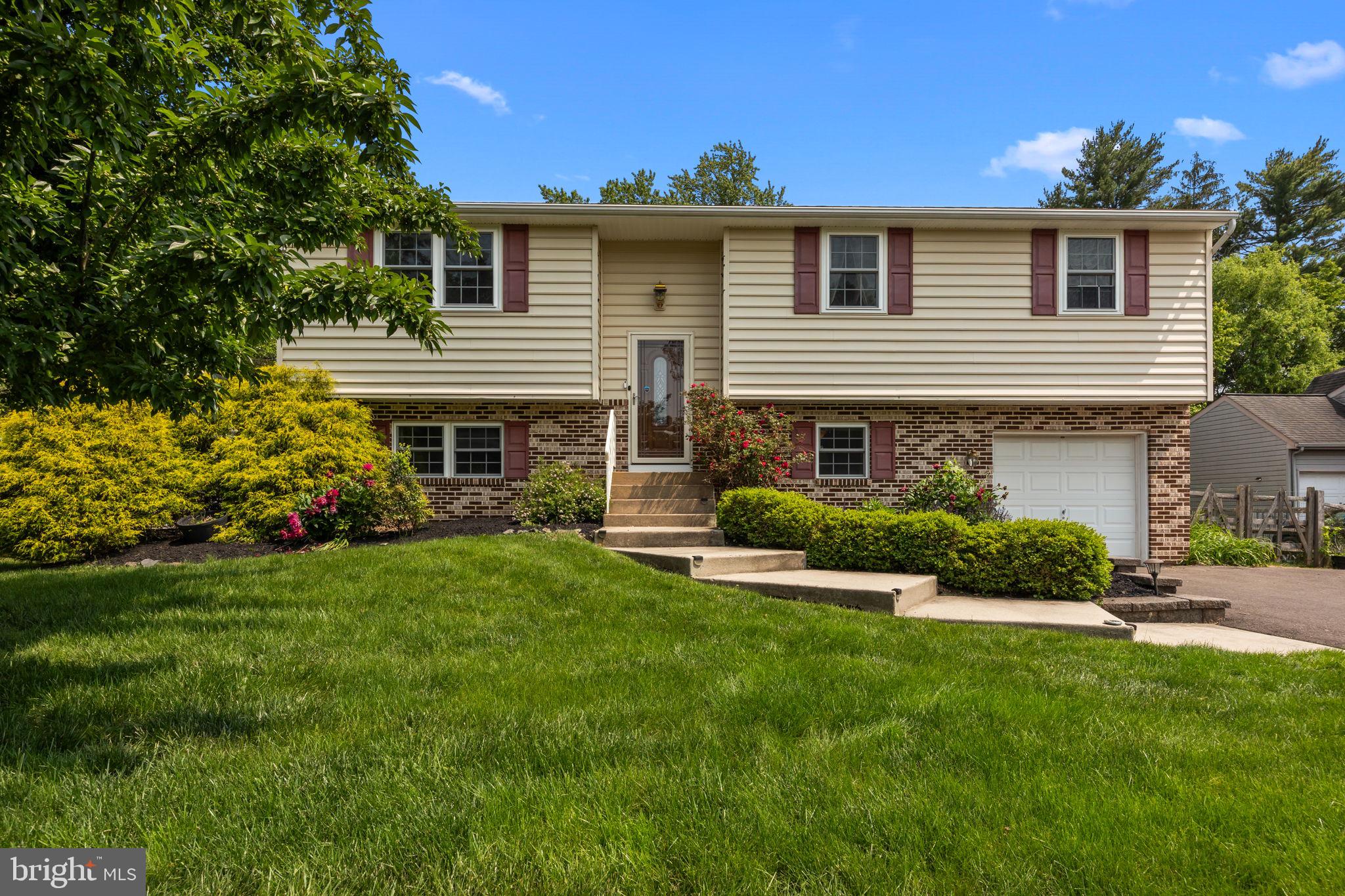 320 Pheasant Run Drive Doylestown, PA 18901 - Photo 44 of 47 a front view of a house with a yard and garage