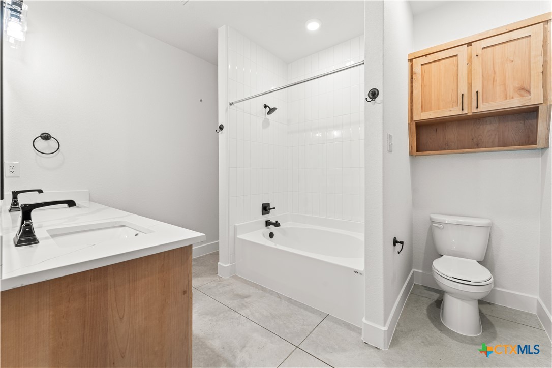 3244 Lois Lane Kempner, TX 76539 - Photo 19 of 35 a bathroom with a sink a toilet and shower