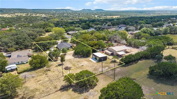 an aerial view of residential house with outdoor space