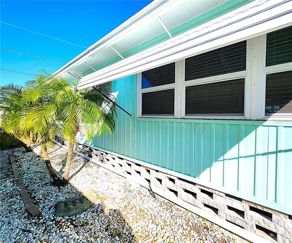 a backyard of a house with seating space