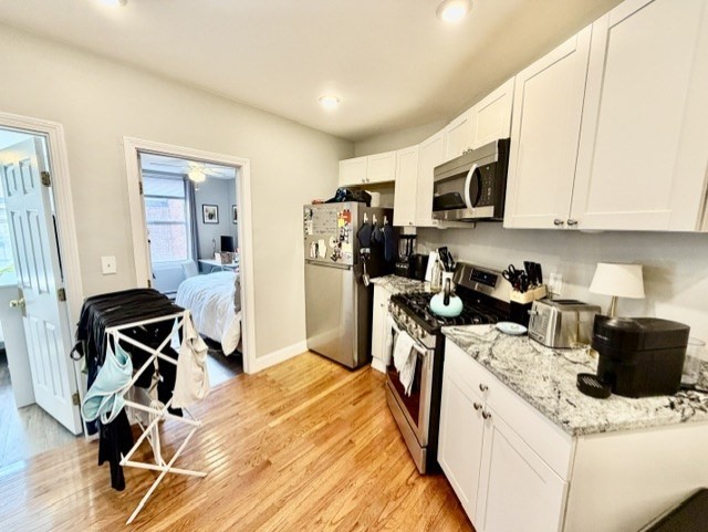 14 Cleveland Place, Unit 3 Boston, MA 02113 - Photo 2 of 22 a view of kitchen with sink and wooden floor