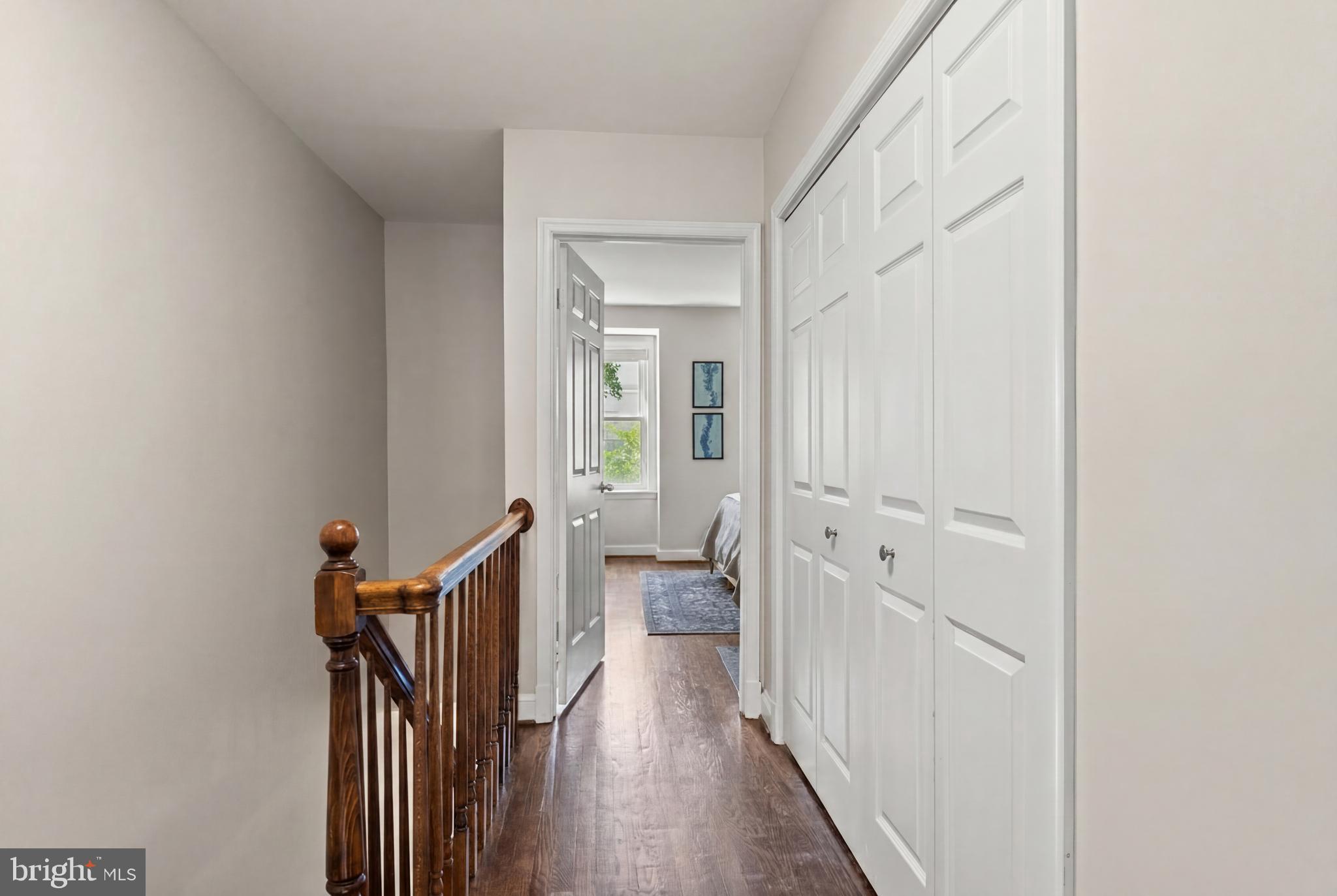 2011 Hillyer Place Northwest Washington, DC 20009 - Photo 9 of 21 a view of a hallway with wooden floor and a bathroom