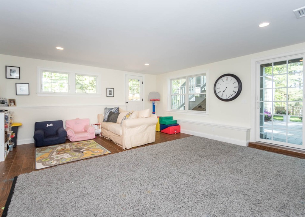 80 Lawton Road Needham, MA 02492 - Photo 25 of 30 a living room with furniture a window and a lamp