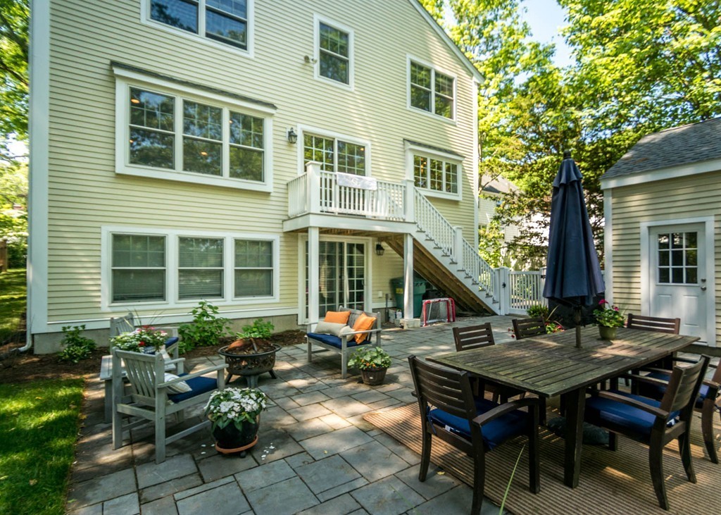 80 Lawton Road Needham, MA 02492 - Photo 29 of 30 a backyard of a house with table and chairs