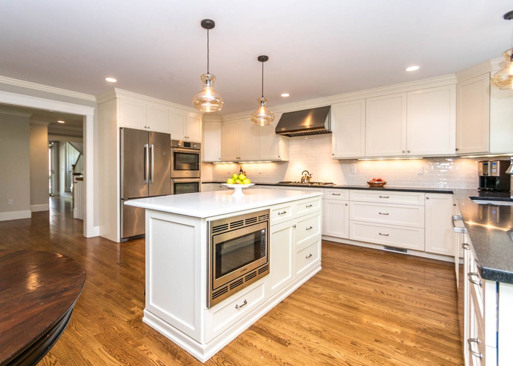 80 Lawton Road Needham, MA 02492 - Photo 6 of 30 a kitchen with stainless steel appliances granite countertop a stove a sink and a refrigerator