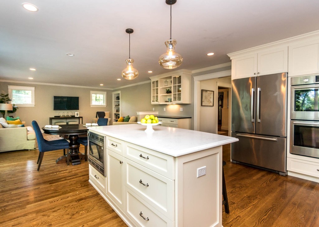 80 Lawton Road Needham, MA 02492 - Photo 7 of 30 a large kitchen with kitchen island a stove a refrigerator a oven a dining table chairs with wooden floor