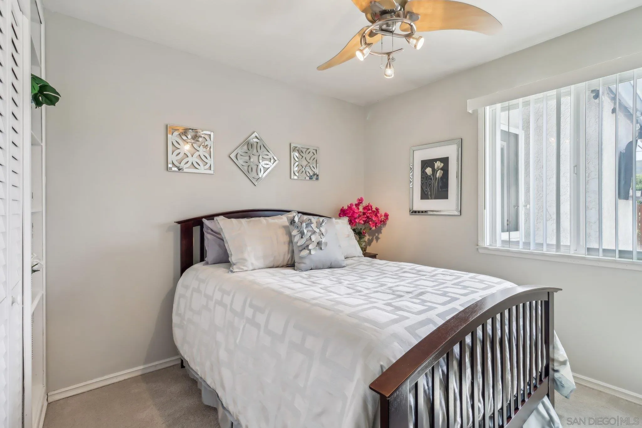 9932 Settle Road Santee, CA 92071 - Photo 29 of 53 a bedroom with a bed and a chandelier