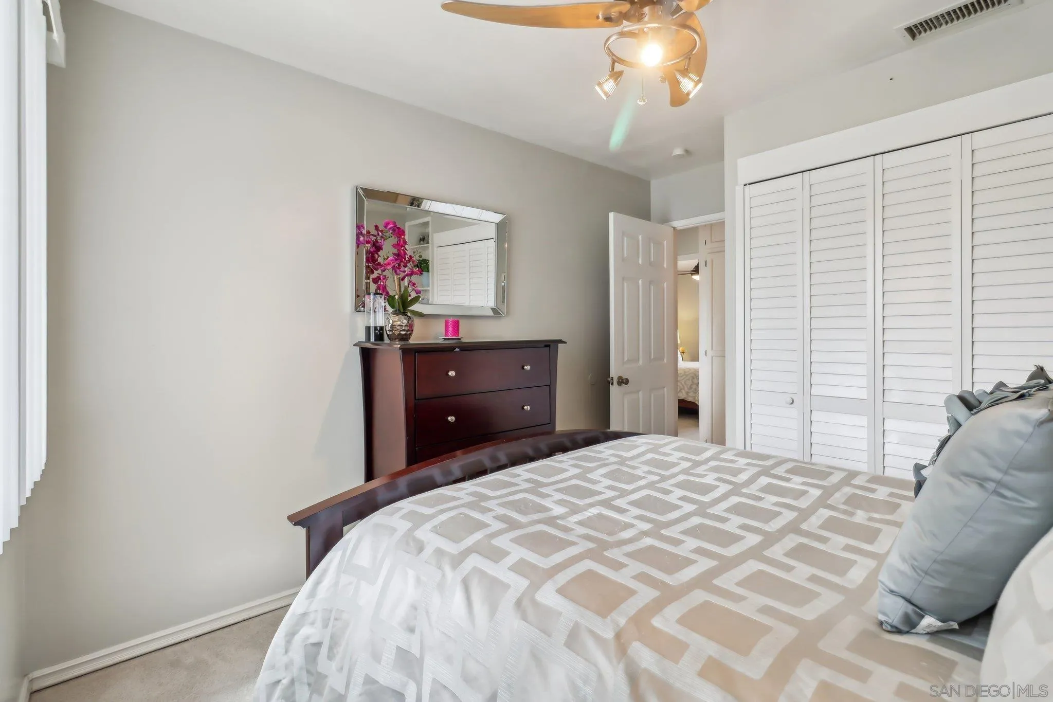 9932 Settle Road Santee, CA 92071 - Photo 31 of 53 a bedroom with a bed and a chandelier
