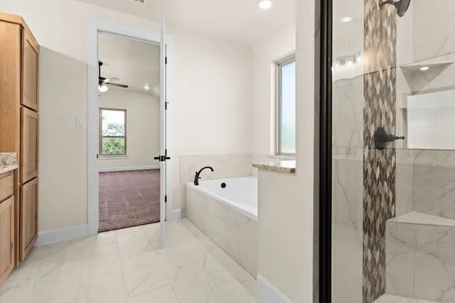 a bathroom with double vanity sink and a mirror