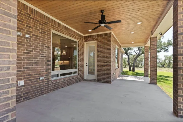 a view of a bathroom with a shower and a sink