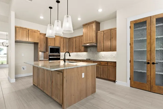 an empty room with a fireplace