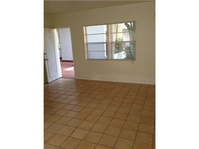 519 North Birch Road, Unit 12 Fort Lauderdale, FL 33304 - Photo 2 of 9 a view of an empty room with windows