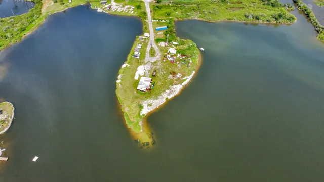 a view of a swimming pool with a yard