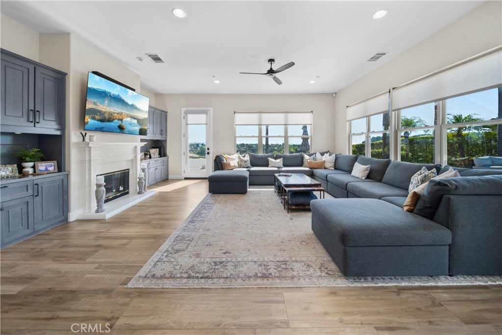 169 Mission Oaks Road Fallbrook, CA 92028 - Photo 18 of 35 a living room with furniture fireplace and a large window