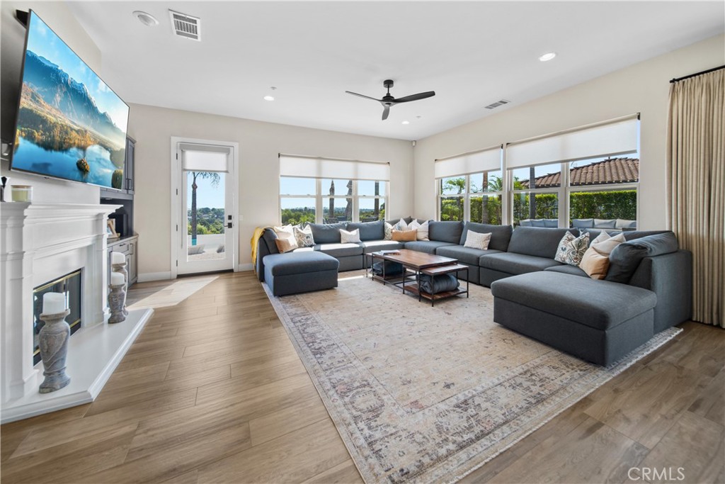 169 Mission Oaks Road Fallbrook, CA 92028 - Photo 20 of 35 a living room with furniture fireplace and a large window