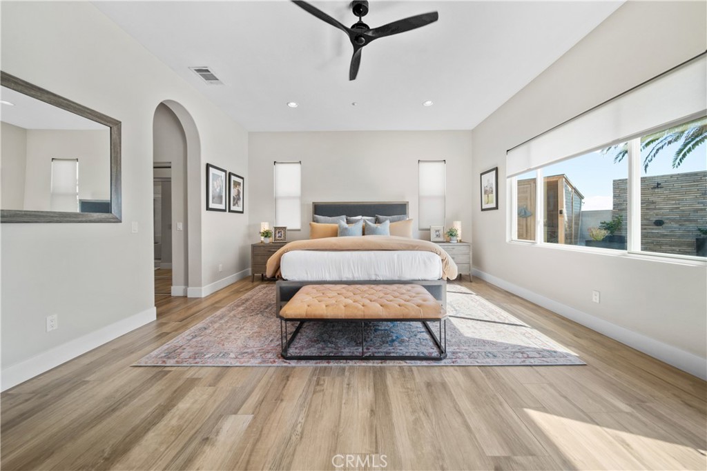 169 Mission Oaks Road Fallbrook, CA 92028 - Photo 21 of 35 a bedroom with a bed and wooden floor