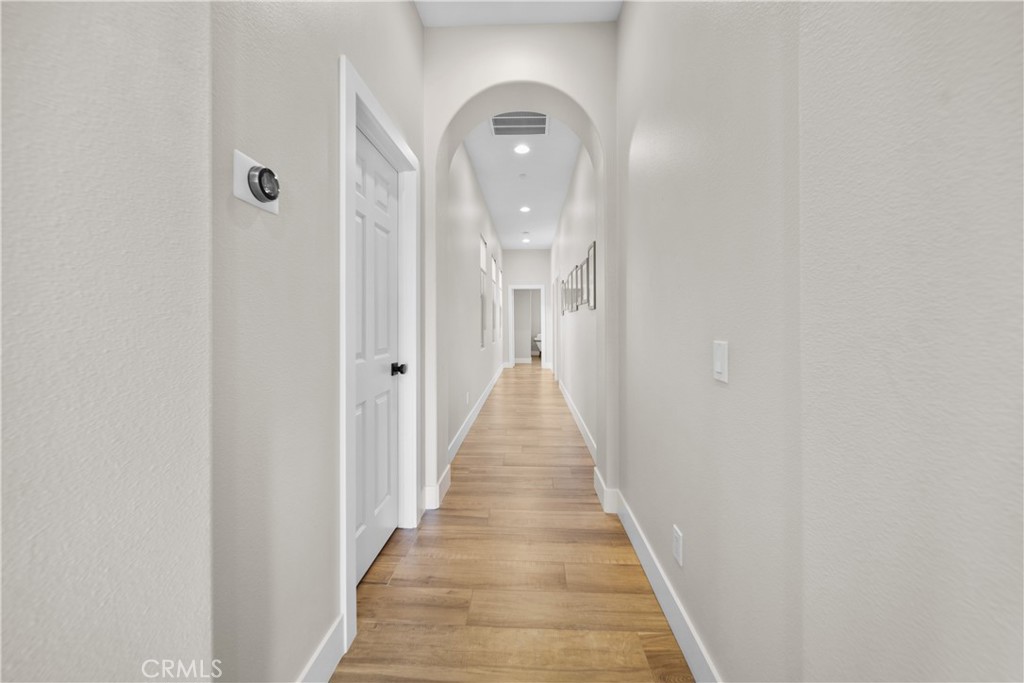 169 Mission Oaks Road Fallbrook, CA 92028 - Photo 26 of 35 a view of a hallway with wooden floor and staircase