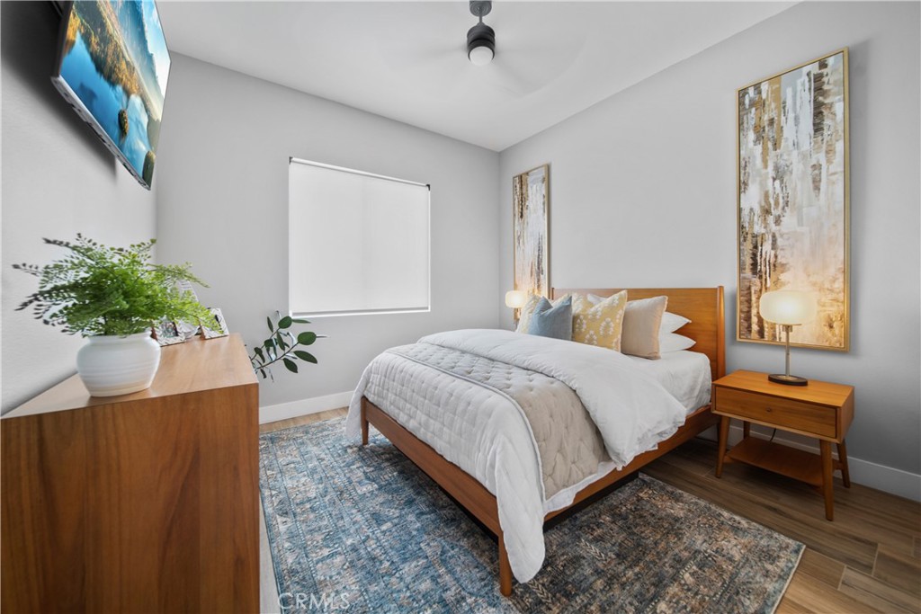 169 Mission Oaks Road Fallbrook, CA 92028 - Photo 27 of 35 a bedroom with a bed and a potted plant