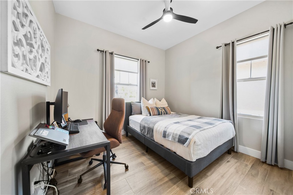 169 Mission Oaks Road Fallbrook, CA 92028 - Photo 28 of 35 a bedroom with a bed and a table in it