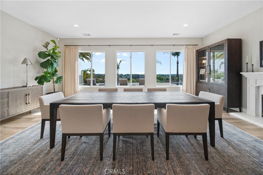 169 Mission Oaks Road Fallbrook, CA 92028 - Photo 9 of 35 a dining room with furniture wooden floor and a rug