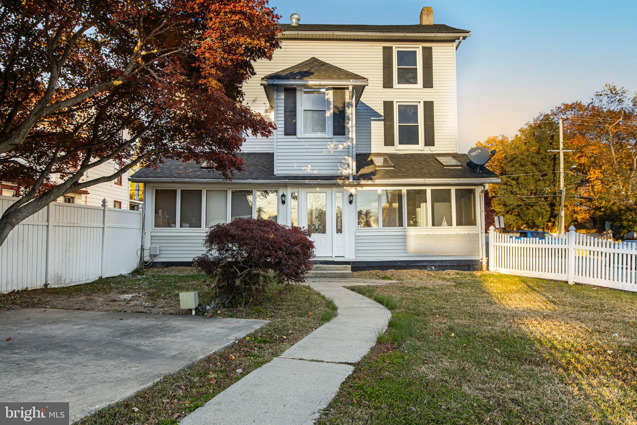 110 Delaware Avenue Elkton, MD 21921 - Photo 12 of 65 a front view of a house with a yard table and chairs