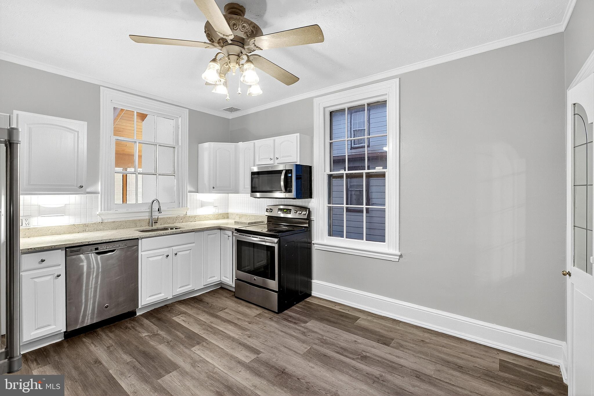 110 Delaware Avenue Elkton, MD 21921 - Photo 25 of 65 a kitchen with stainless steel appliances granite countertop a stove and a sink