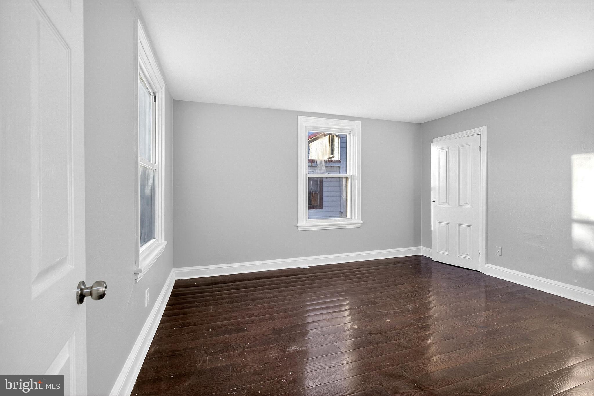 110 Delaware Avenue Elkton, MD 21921 - Photo 38 of 65 wooden floor in an empty room with a window