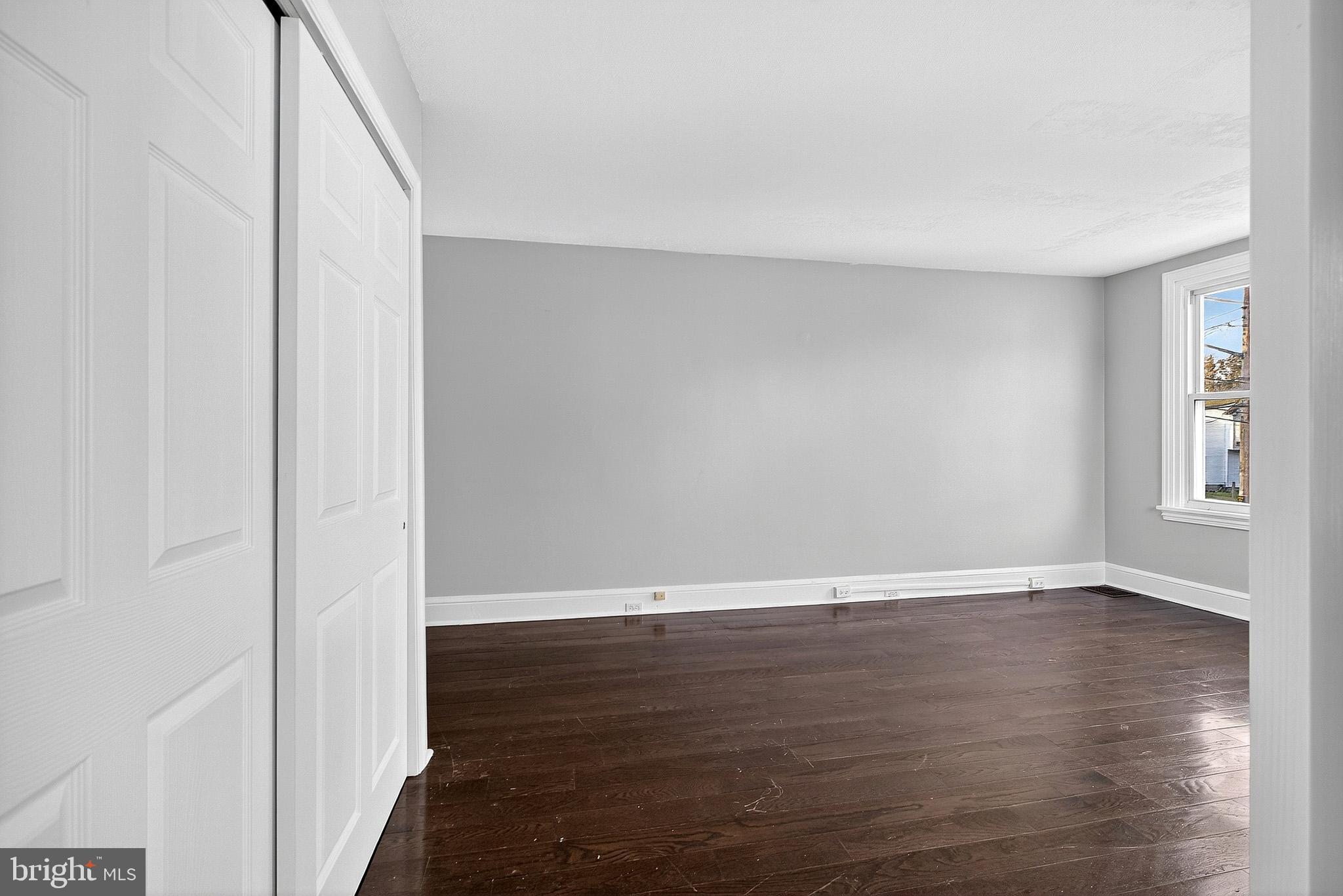 110 Delaware Avenue Elkton, MD 21921 - Photo 44 of 65 a view of an empty room with wooden floor