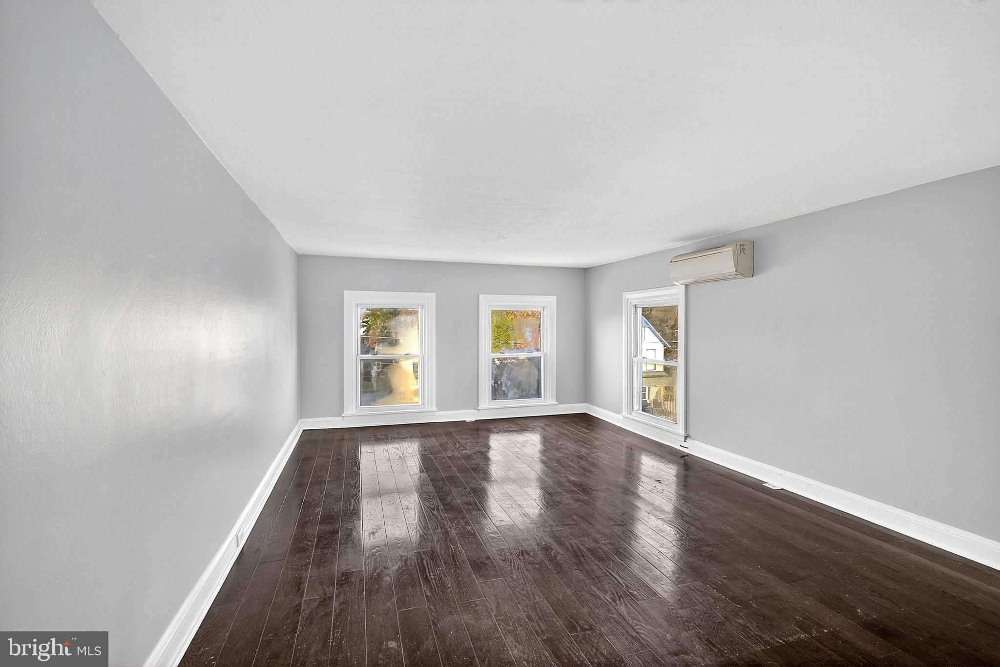 110 Delaware Avenue Elkton, MD 21921 - Photo 53 of 65 a view of an empty room with wooden floor and a window