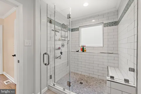 a bathroom with double vanity sinks a vanity and a mirror