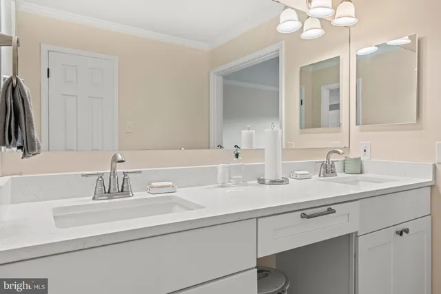 a bedroom with a bed and a ceiling fan