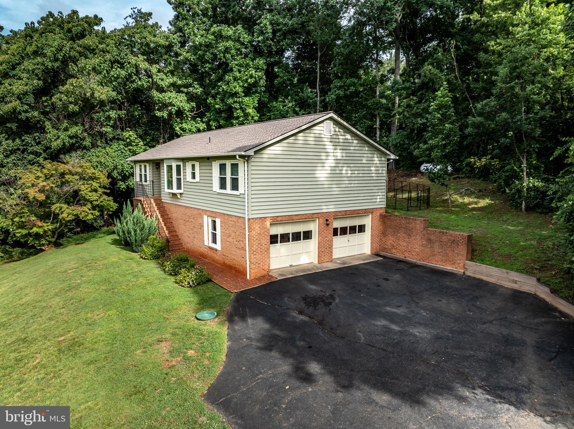 240 Boxley Lane Orange, VA 22960 - Photo 4 of 46 a view of a house with a yard plants and large trees