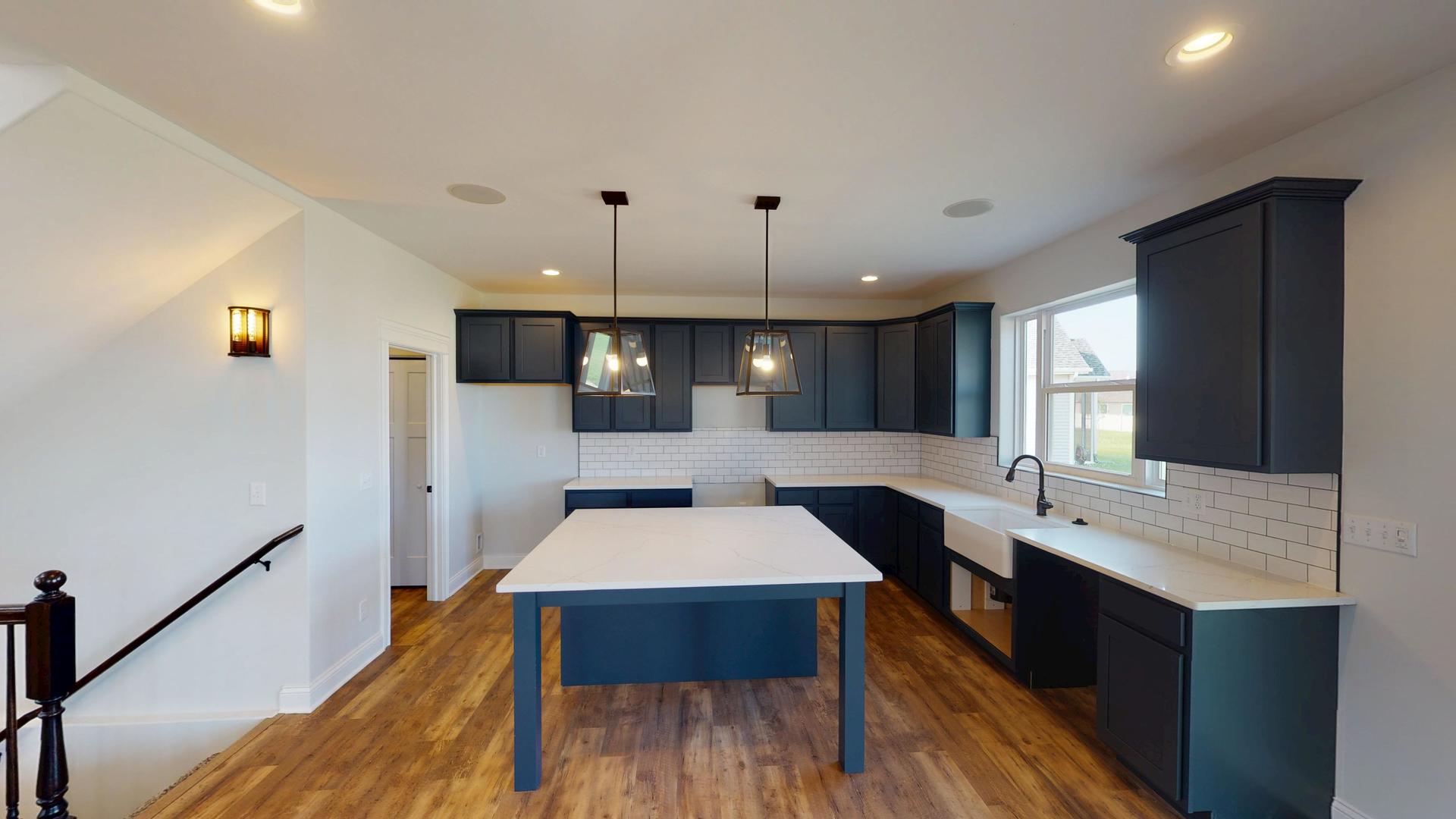 118 Cache Isle Circle Channahon, IL 60410 - Photo 11 of 32 a large kitchen with a table and chairs