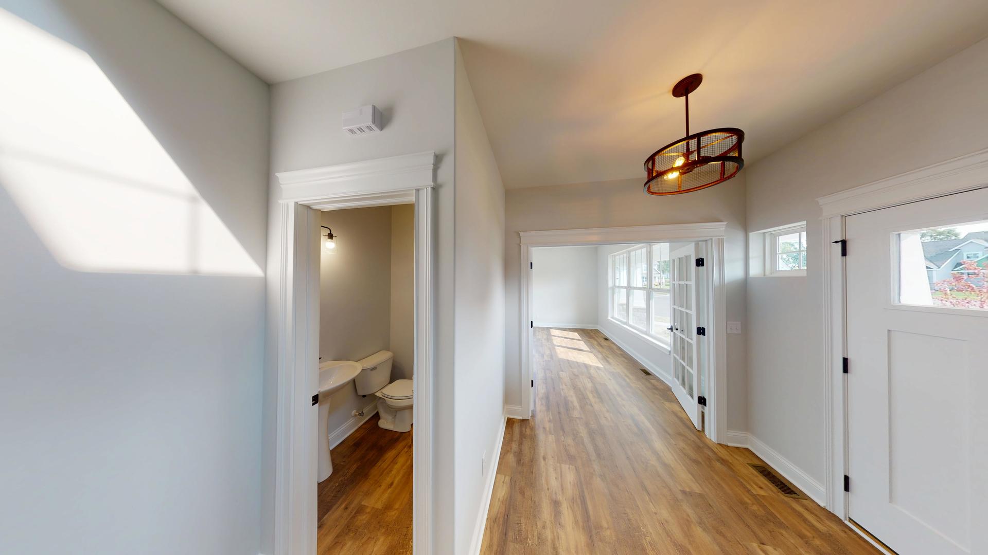 118 Cache Isle Circle Channahon, IL 60410 - Photo 16 of 32 a view of a hallway with wooden floor and staircase