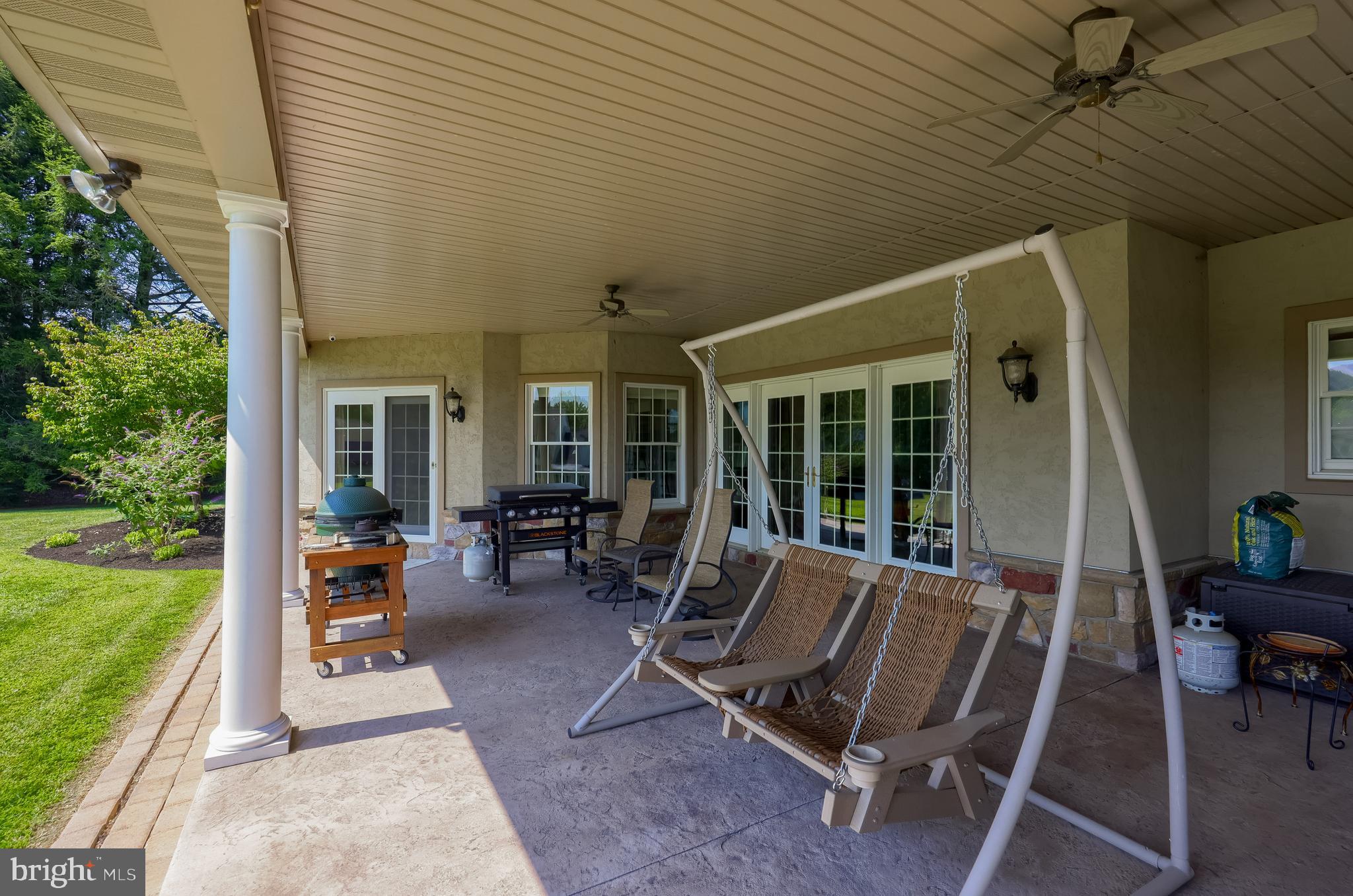 890 Fishburn Road Hershey, PA 17033 - Photo 103 of 103 a view of a patio with table and chairs and potted plants with wooden floor and fence