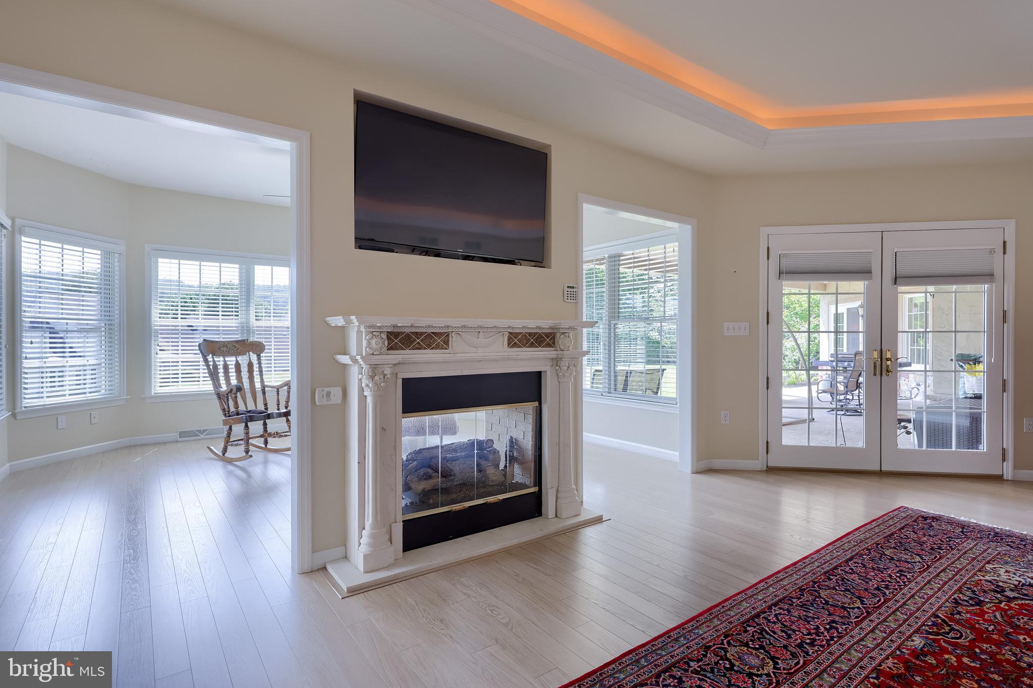890 Fishburn Road Hershey, PA 17033 - Photo 44 of 103 a view of a livingroom with furniture a fireplace and wooden floor